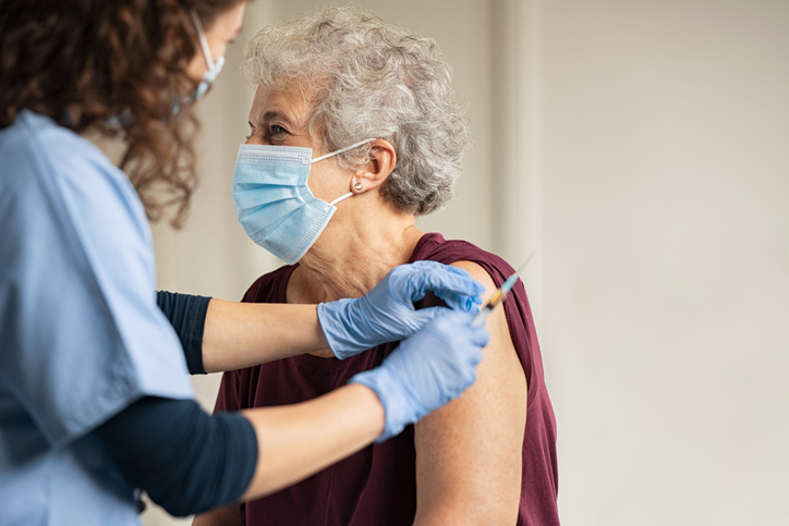 Elderly person being vaccinated for Covid19